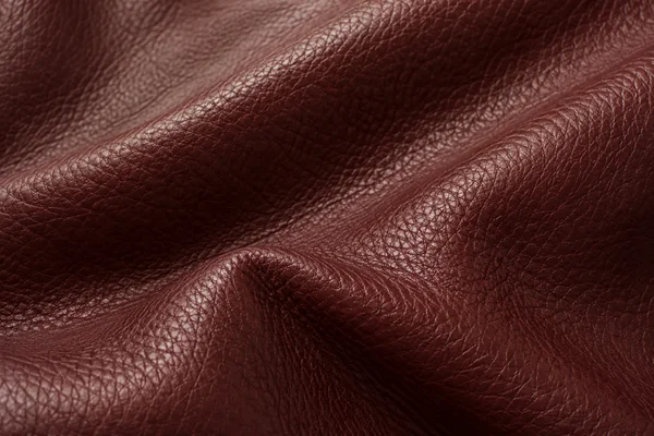 Burgundy leather with natural grain, soft creases and satin highlights.