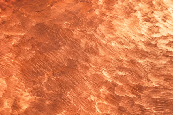 Fresh red-gold copper with fine scratches and subtle hammering.