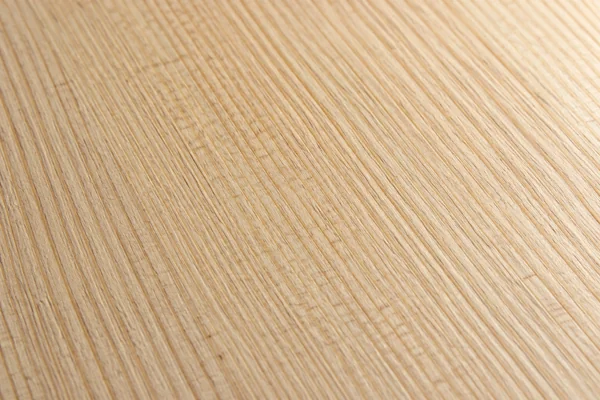 Pale spruce has fine straight growth lines and a lightly planed surface.